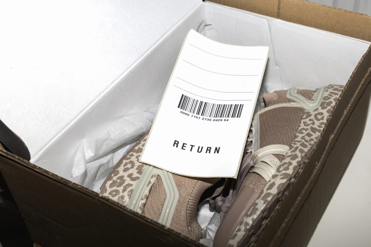 Return label placed on top of shoes in box ready to return