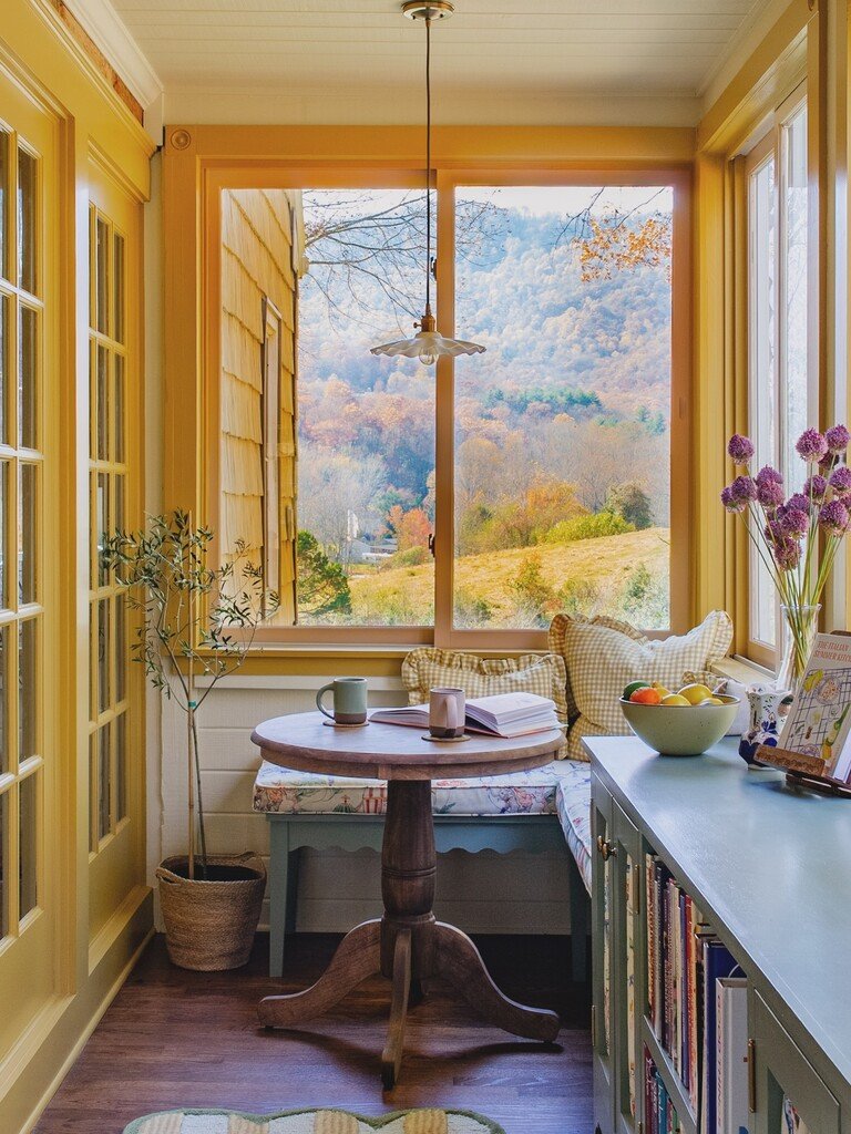 Sun room with trim painted in No. 66 India Yellow by Farrow & Ball