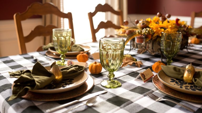 A festive dining table decorated for Thanksgiving.