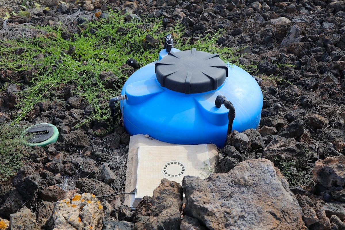 An underground plastic dry well tank.