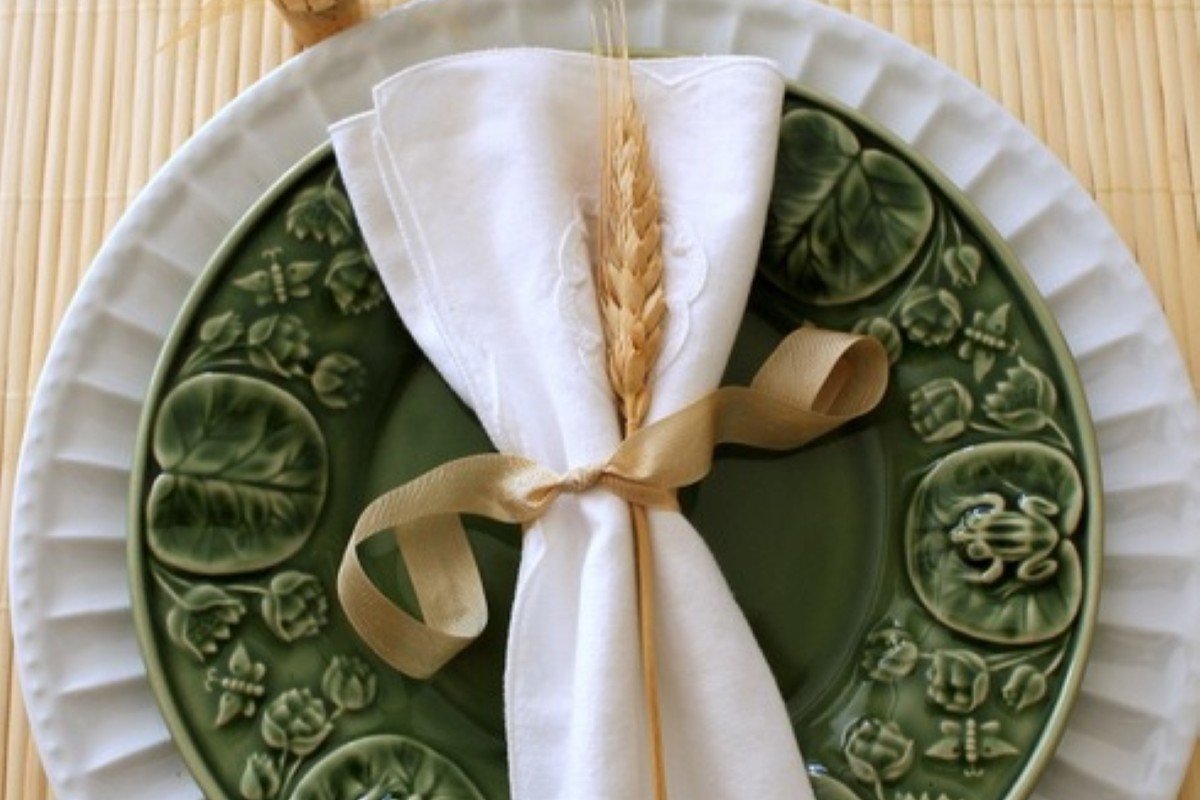 A miniature sheave featuring wheat bound with ribbon.