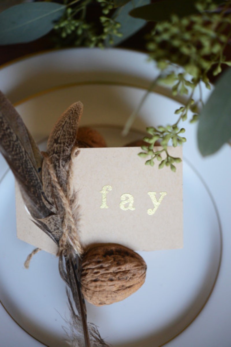 Using walnuts to decorate a name card.