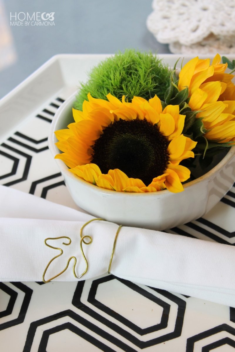 A sunny flower arrangement made with sunflowers for a dinner table.
