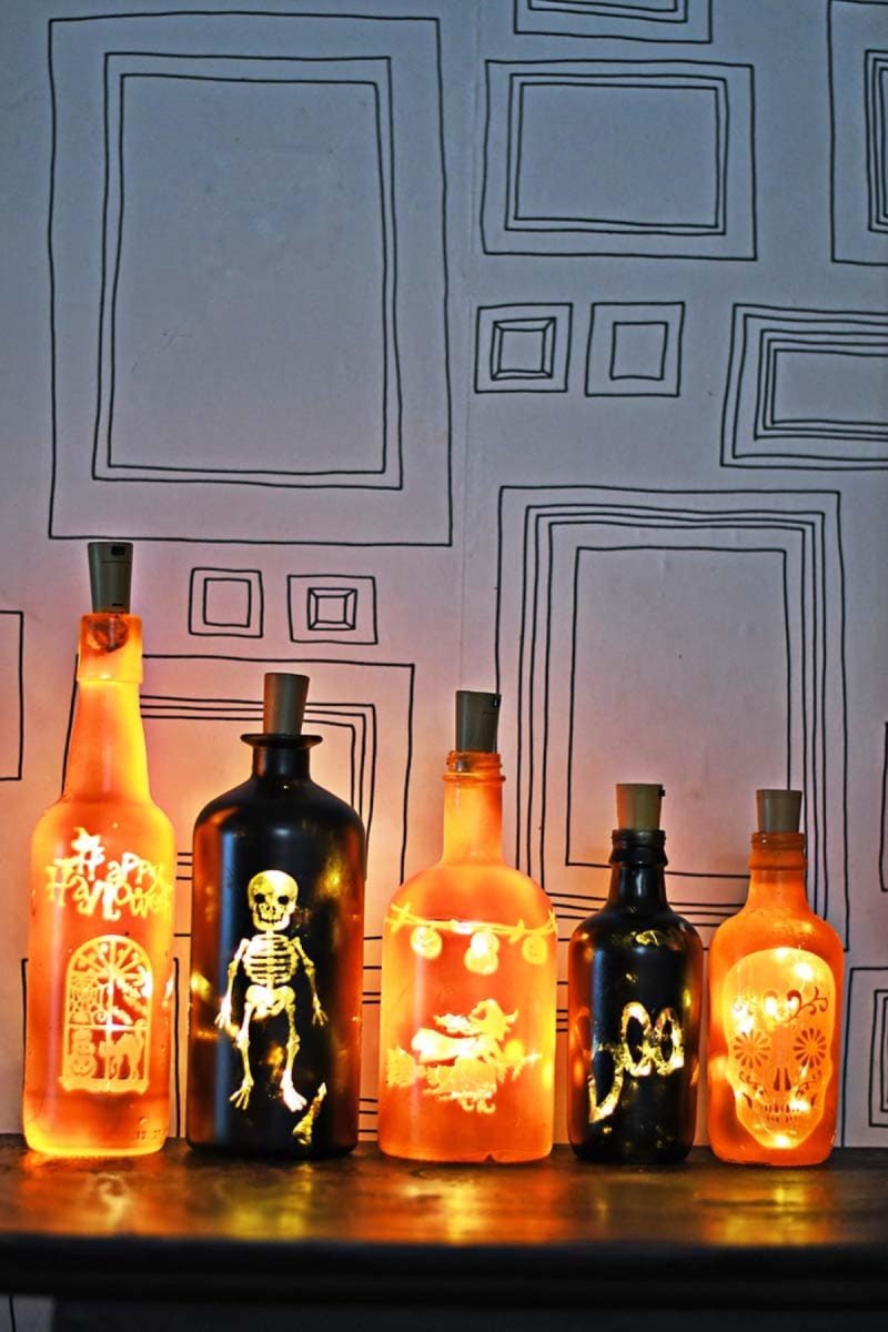 Halloween themed bottles with glowing lights.