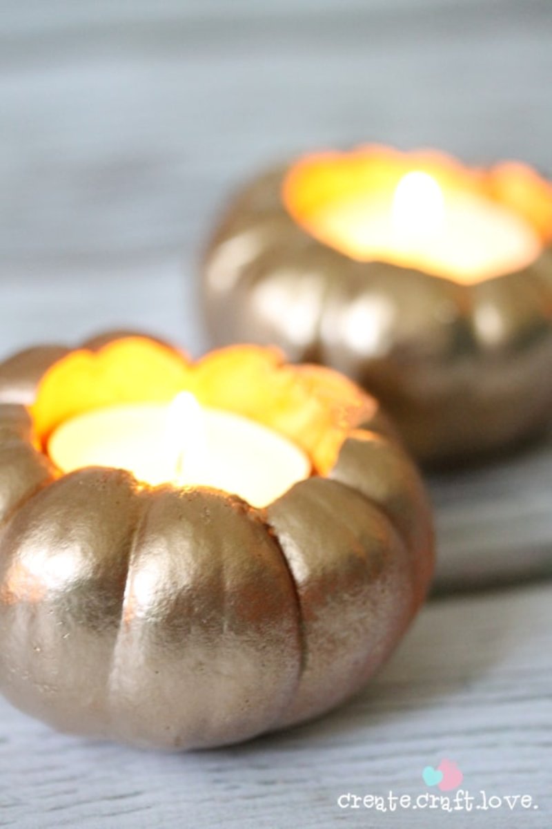 Two little votives  recreated by hollowing out a mini pumpkin.